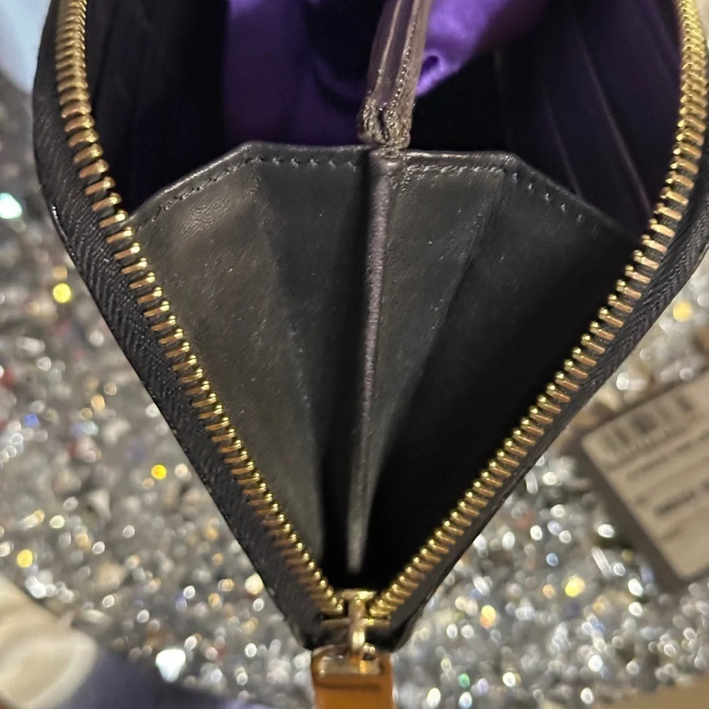 Vintage Fendi black patent leather zip-around continental wallet.